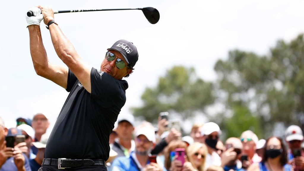 Phil Mickelson watches a tee shot.