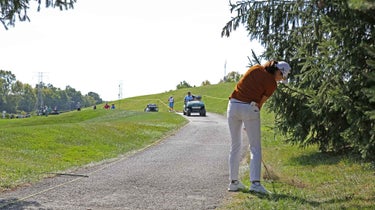 golfer standing cart path