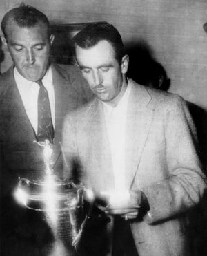 Left to right, Vic Ghezzi, Llyod Mangrum, and Byron Nelson looking at the U.S. Open Championship trophy in 1946.