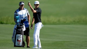 joaquin niemann grabs club from bag