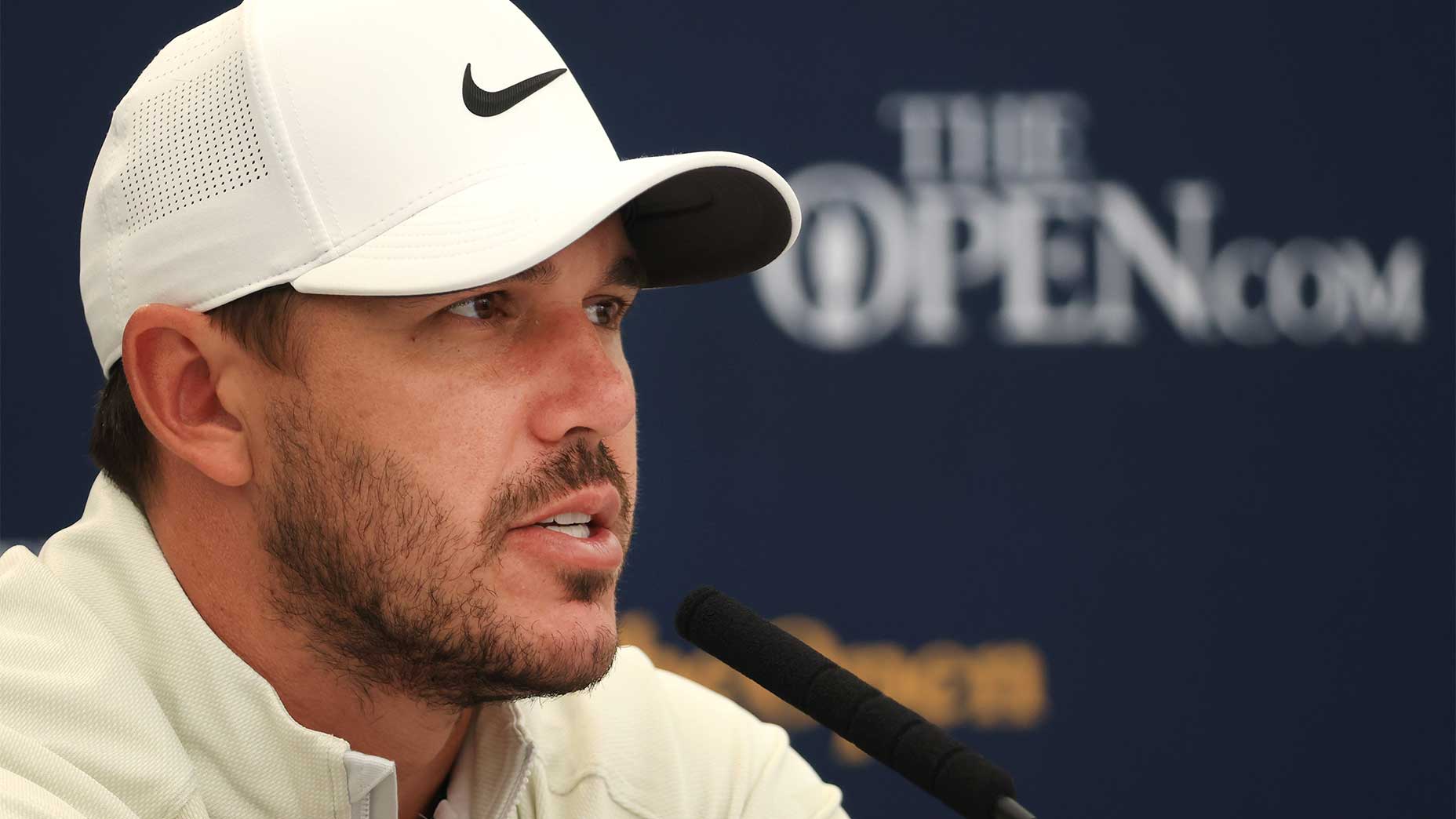 Brooks Koepka talks to the media on Tuesday at Royal St. George's.