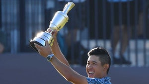 collin morikawa lifts trophy
