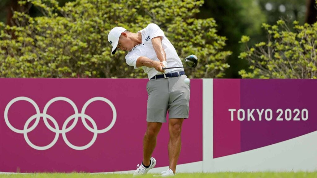 Collin Morikawa takes a swing during a practice round in Japan.