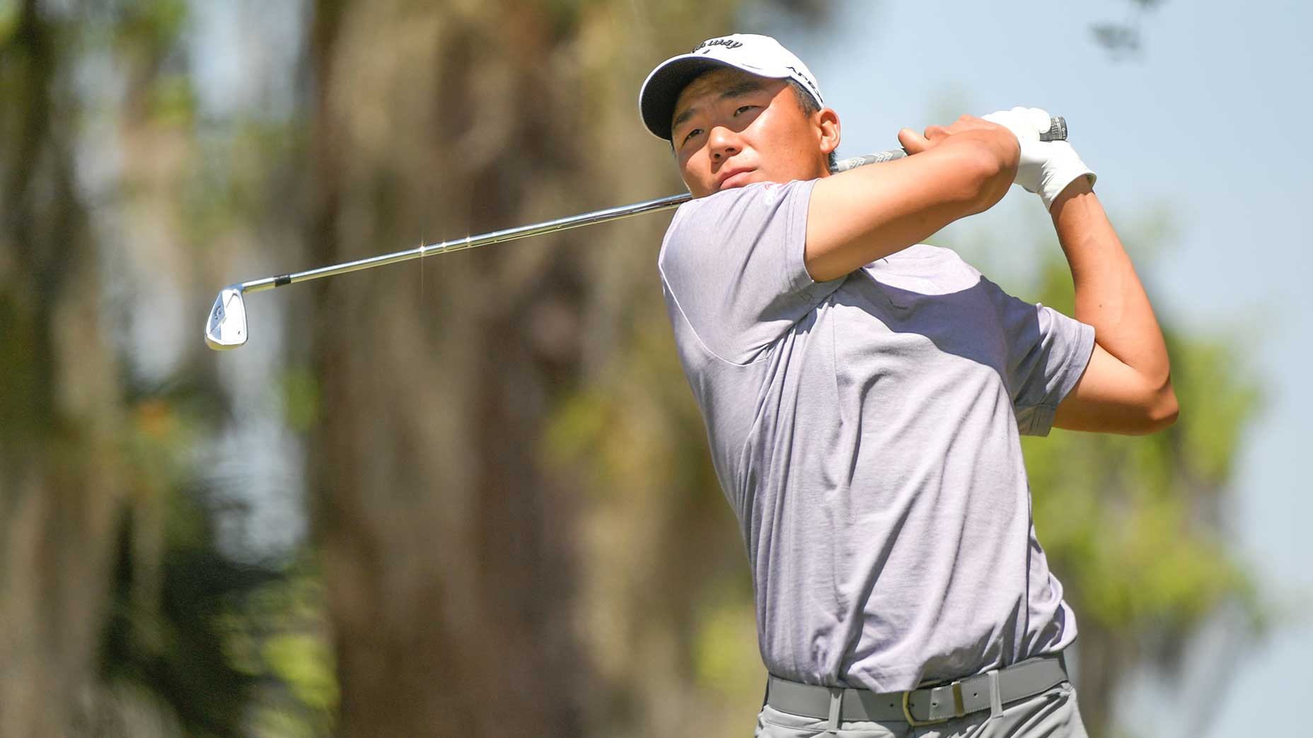 Norman Xiong hits a tee shot.