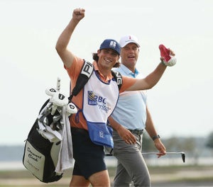 Stewart Cink and Reagan Cink react as they approach the 18th green during the final round of the RBC Heritage in 2021.
