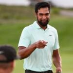 Tony Finau sharing in the celebration with his coach Boyd Summerhays.