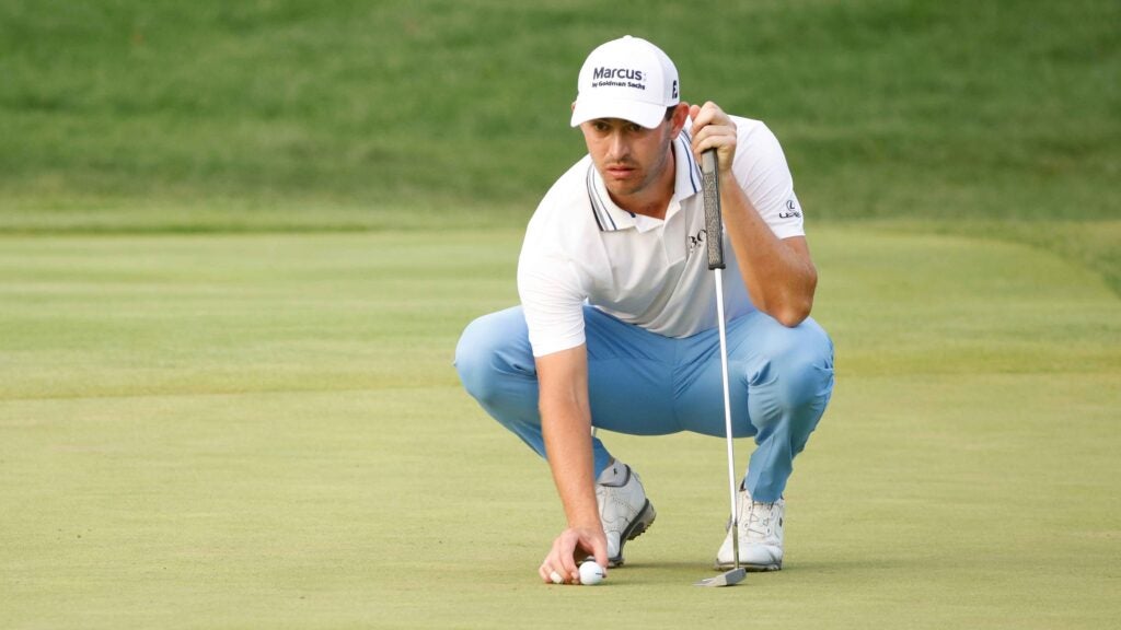 cantlay lining up putt at bmw