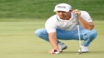 cantlay lining up putt at bmw