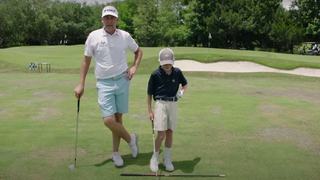 ian poulter stands with his son