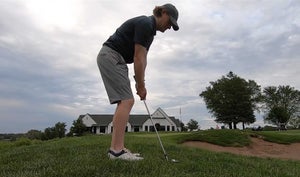 A golfer hits a ball at Keller Golf Course.