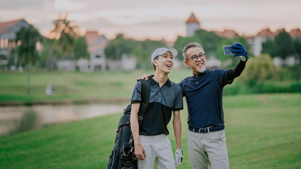 Golfers take selfie on golf course