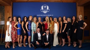 KOHLER, WISCONSIN - SEPTEMBER 22: (Front L-R) Viktor Hovland of Norway and team Europe and Matthew Fitzpatrick of England and team Europe pose with (L-R) Helen Storey, Irene Scholz, Angela Akins Garcia, Diane Antonopoulos, Katie Poulter, Emma Lofgren, Pollyanna Woodward, Kelley Cahill, Kristin Stape, Caroline Harrington, Erica Stoll, Emily Braisher, Wendy Honner, Clare Fleetwood and Ebba Karlsson pose for a photo during the Team Europe Gala Dinner prior to the 43rd Ryder Cup at The American Club on September 22, 2021 in Kohler, Wisconsin. (Photo by Warren Little/Getty Images)