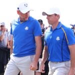 KOHLER, WISCONSIN - SEPTEMBER 24: Ian Poulter of England and team Europe (L) and Rory McIlroy of Northern Ireland and team Europe walk across the course during Friday Morning Foursome Matches of the 43rd Ryder Cup at Whistling Straits on September 24, 2021 in Kohler, Wisconsin. (Photo by Warren Little/Getty Images)