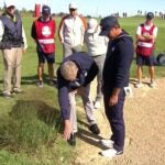 brooks koepka talks to a rules official at the ryder cup