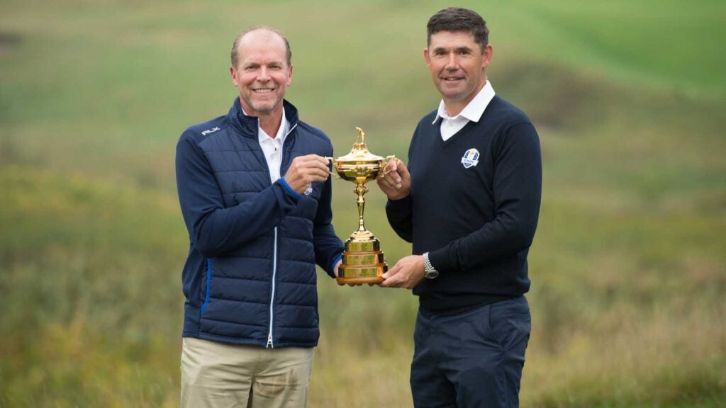 two men with trophy