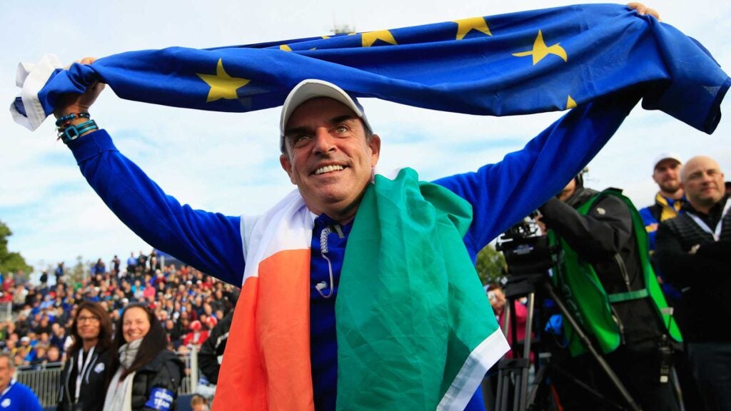 paul mcginley with flag over his head