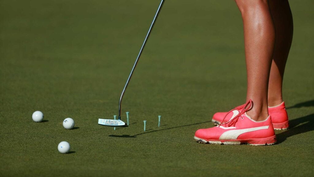 girl practices putting