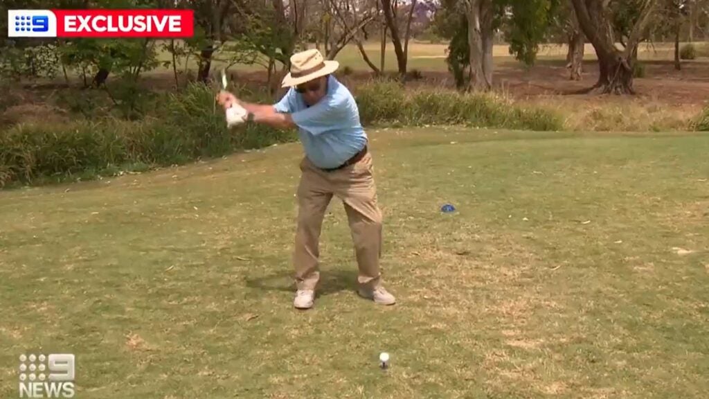 99-year-old golfer Hugh Brown takes tee shot on Australian golf course