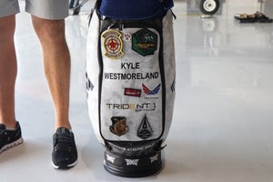 Kyle Westmoreland's PXG staff bag with military badges and patches.