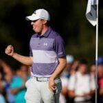 Matthew Fitzpatrick fist-pumps on the 18th green