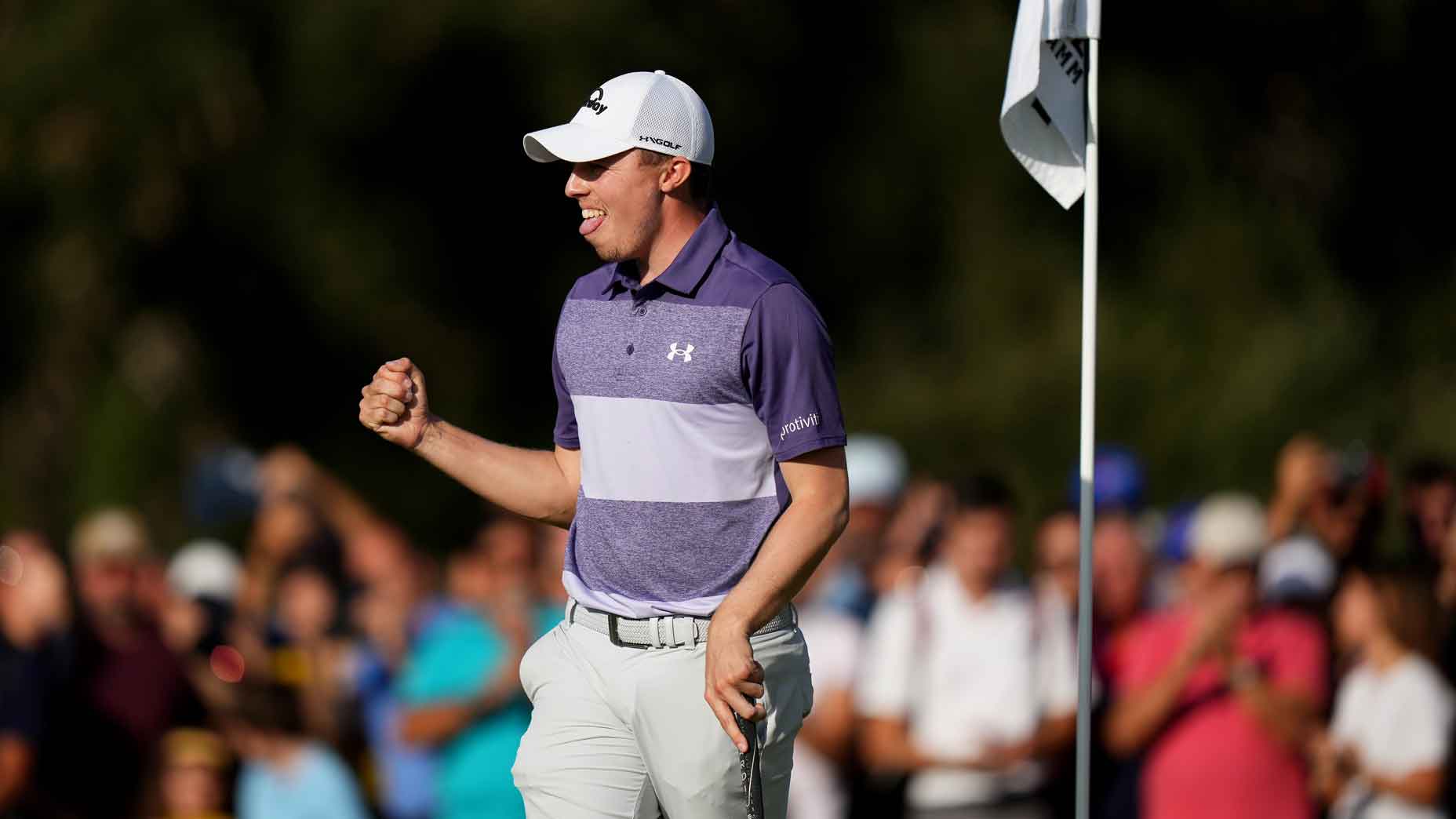 Matthew Fitzpatrick fist-pumps on the 18th green