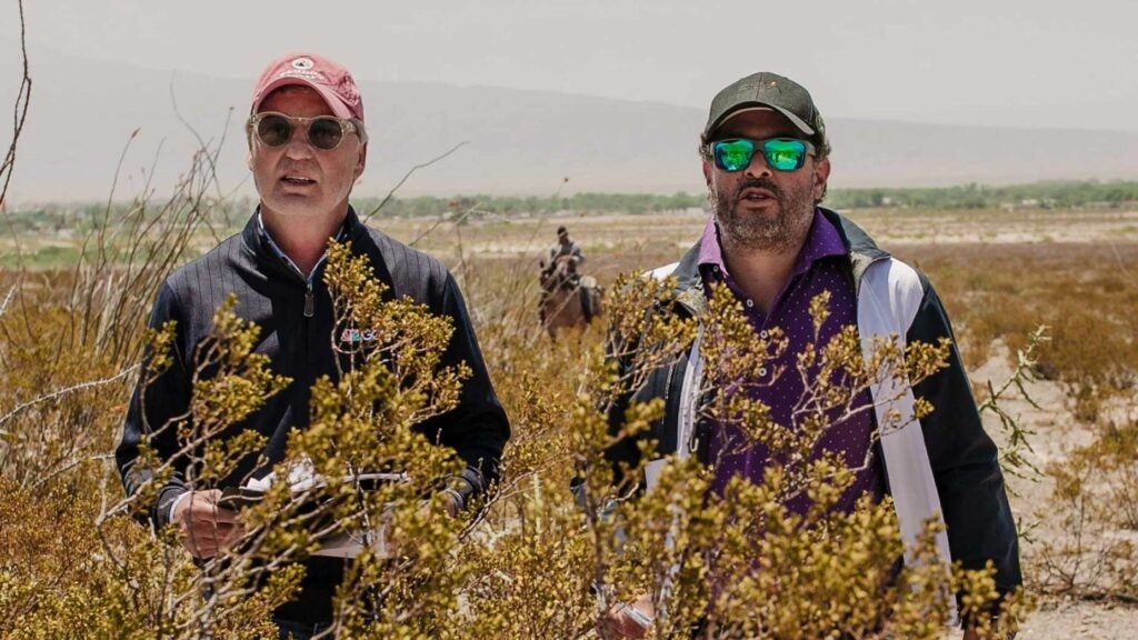 Augustin Piza and Brandel Chamblee stand in tall grass at the Butterfly Effect / Desertica project