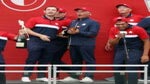 U.S. Ryder Cup captain Fred Couples holds champagne with U.S. players during victory celebration
