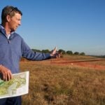 gil hanse holding a course map