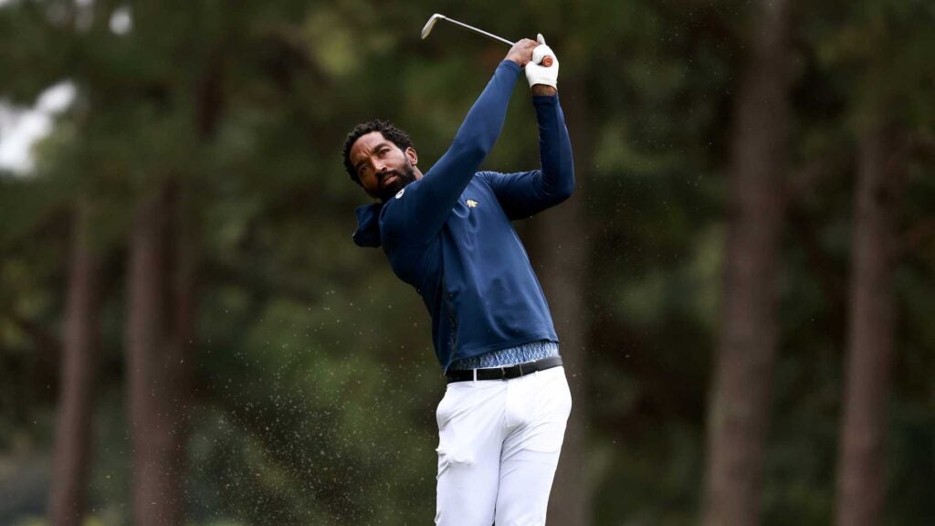 jr smith swings a golf club during his college golf debut