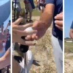 phil mickelson handing ball to fan at 2021 PGA
