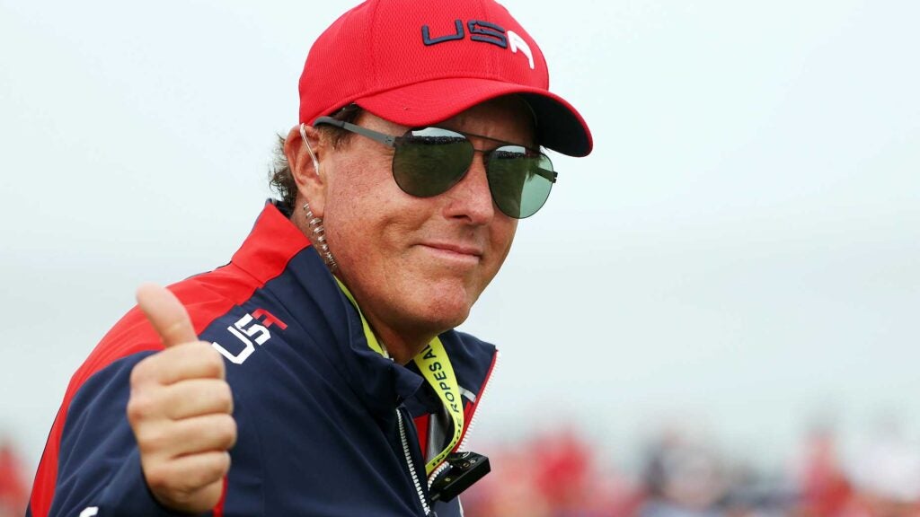 Phil Mickelson flashes a thumbs up to a photographer while walking course at 2021 Ryder Cup