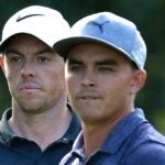 Rory McIlroy of Northern Ireland and Rickie Fowler of the United States prepare to tee off on the 16th tee during the first round of the 2017 PGA Championship at Quail Hollow Club on August 10, 2017 in Charlotte, North Carolina.