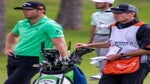 Sam Burns waits in fairway with caddie and golf bag at 2021 Shriners Children's Open