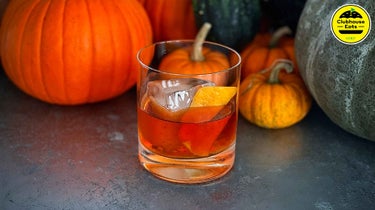 A close-up of a whiskey old fashioned cocktail