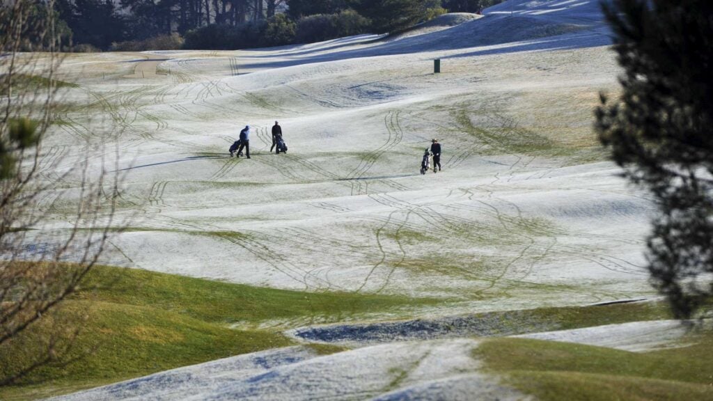 golfers playing in winter