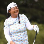 christina kim laughs during an lpga golf tournament