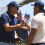 KIAWAH ISLAND, SC - MAY 23: Phil Mickelson fist bumps Brooks Koepka on the first hole during the final round of the 2021 PGA Championship held at the Ocean Course of Kiawah Island Golf Resort on May 23, 2021 in Kiawah Island, South Carolina. (Photo by Montana Pritchard/PGA of America via Getty Images)