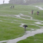 The flooded 18th fairway is pictured after heavy rainfall during the opening fourball round on the first day of the 2010 Ryder Cup golf competition between US and Europe at Celtic Manor golf course in Newport, Wales on October 1, 2010. AFP PHOTO/GLYN KIRK (Photo credit should read GLYN KIRK/AFP via Getty Images)
