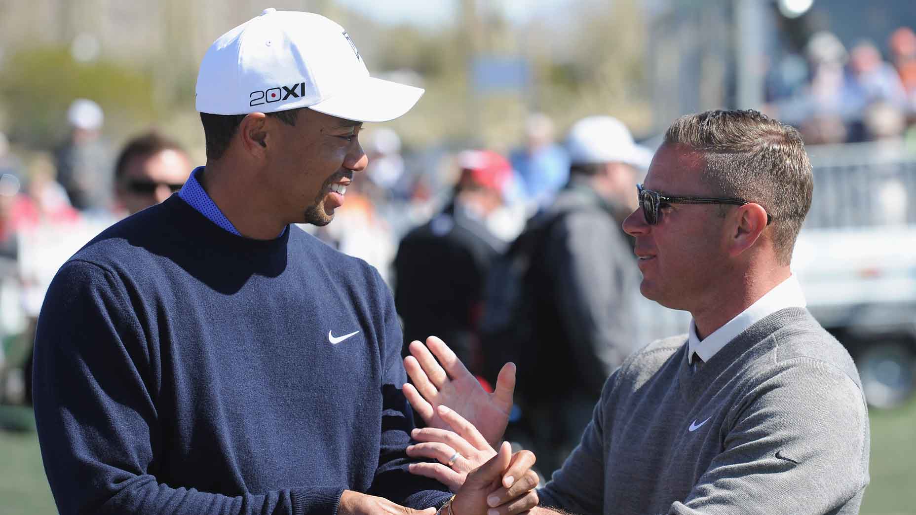 Sean Foley talks to Tiger Woods