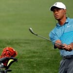 Tiger Woods hits a wedge