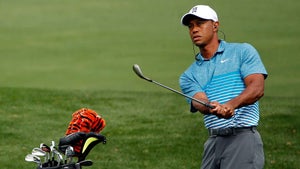 Tiger Woods hits a wedge