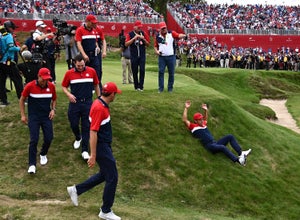 Xander Schauffele with a celebratory slide at the Ryder Cup.