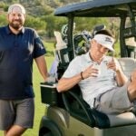 drew stoltz and colt knost with a golf cart