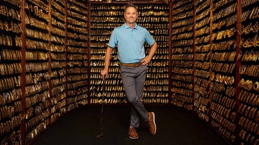 John K. Solheim, Ping chairman-to-be, standing guard over the company’s future — and its renowned Gold Putter Vault — at HQ.