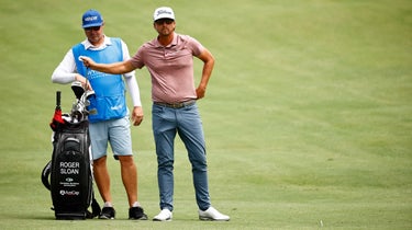 Roger Sloan of Canada waits with his caddie Danny Stout on the 11th fairway during the final round of the Wyndham Championship at Sedgefield Country Club on August 15, 2021 in Greensboro, North Carolina.