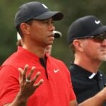 Tiger Woods raises hands during 2021 PNC Championship
