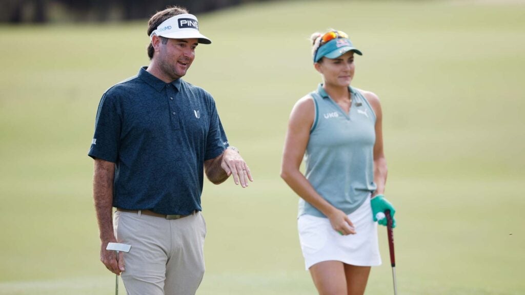 Bubba Watson and Lexi Thompson talk while walking the course during the 2021 QBE Shootout
