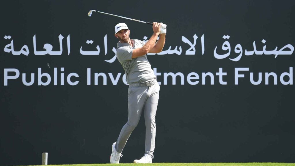 dustin johnson hits tee shot at saudi international