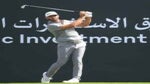dustin johnson hits tee shot at saudi international