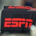 A camera with a red ESPN logo on it.